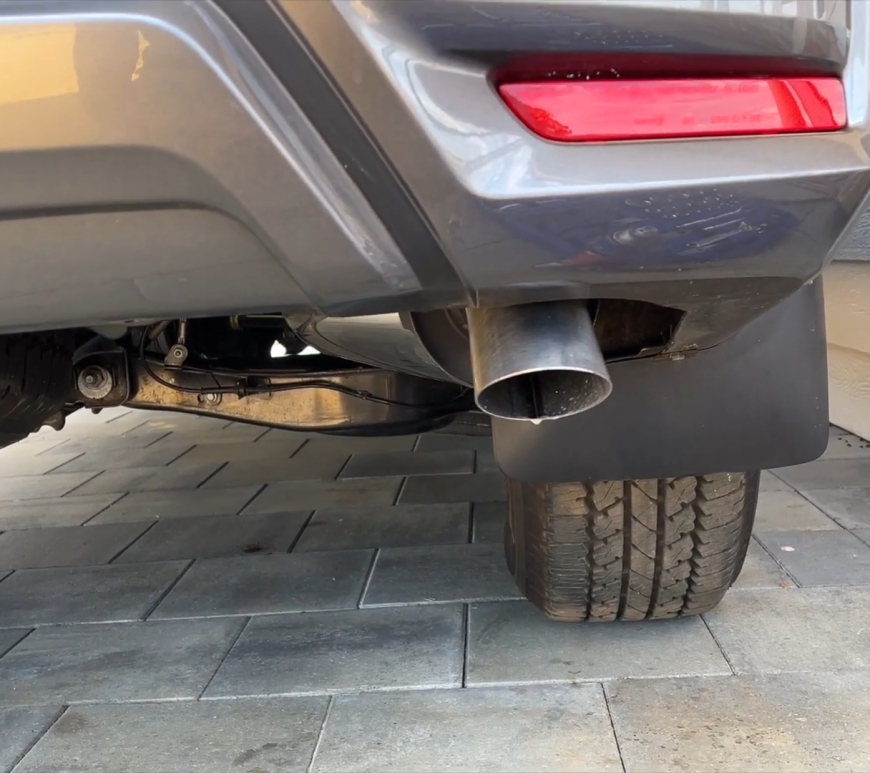 Car parked outside showing the new exhaust pipe at the rear